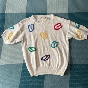 POL baby blue knit sweater with red floral accents all over